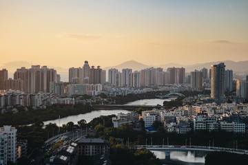 Fototapeta premium Cityscape at sunset in the city of Sanya. Hainan island