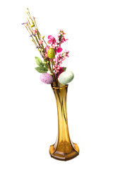 Easter decoration - twig branch with colorful easter eggs in brown vase, isolated on white background