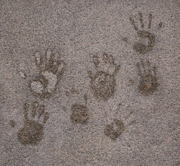 Palm prints on the frost-covered granite wall