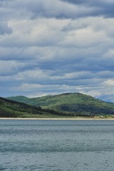 lake close to forest in summer season in sunny day