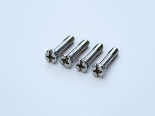 Phillips head stainless steel screw isolated on white background