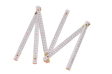 White wooden carpenter meter with brass ending, isolated on white background