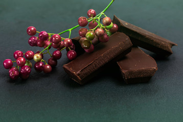 Pieces of chocolate on gray slate