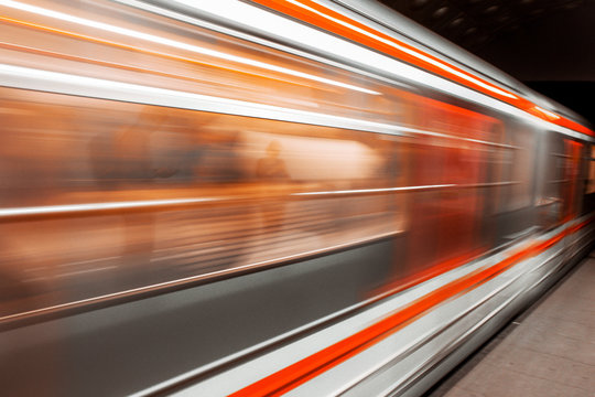 Modern Metro subway Station speed fast Red Blue european public transport for people . Motion speed blur fast moving and arriving time, not late, business Epic trendy cityscape concept . Elevated Road