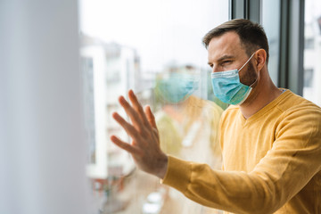 Man wearing medical face mask against the corona virus, covid-19. Quarantine, isolation concept.