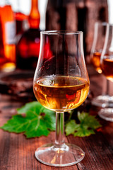 Tasting of aged french cognac brandy in old cellars of cognac-producing regions Champagne or Bois, France