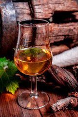 Tasting of aged french cognac brandy in old cellars of cognac-producing regions Champagne or Bois, France