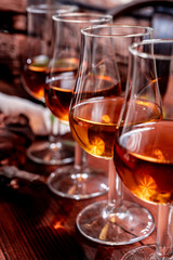 Tasting of aged french cognac brandy in old cellars of cognac-producing regions Champagne or Bois,...
