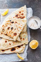 Homemade flatbread stuffed with potato herbs and cheese.