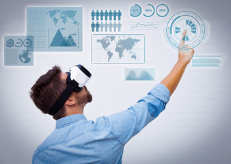 Bearded guy wearing VR goggles for virtual data analysis and pointing finger up. Young man in virtual reality headset standing isolated over white background. VR technology or advertising concept