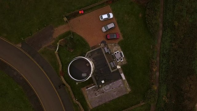 Aerial footage of cliffs and lighthouse at Hunstanton, Norfolk, UK on a foggy winter's day.