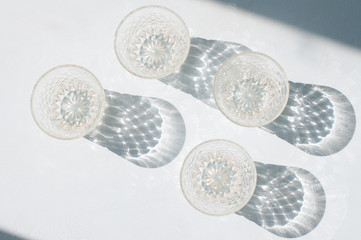Abstract glassware shadows background. Reflections at natural light.