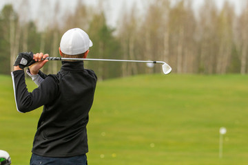 Player a during a golf game during a hit