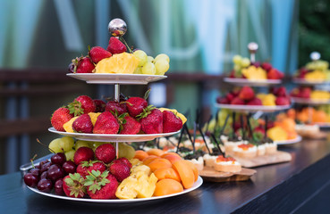 Beautiful festive buffet reception in the summer on a verandah