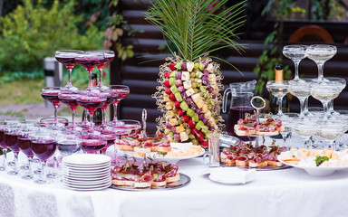 Mini cold snacks on festive table. Party food, catering.