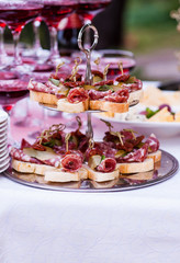 Mini beef burgers, cold snacks, meat and salads