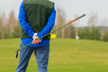 Player a during a golf game during a hit