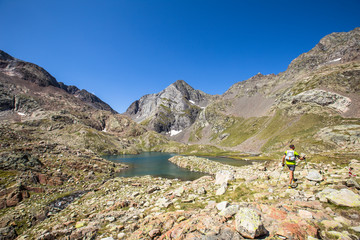 A mountaineer at the Ibon de Panticosa in the Pyrenees, Aragon. Spain