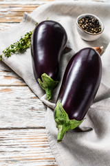 Raw purple eggplant. Organic vegetables. White background. Top view