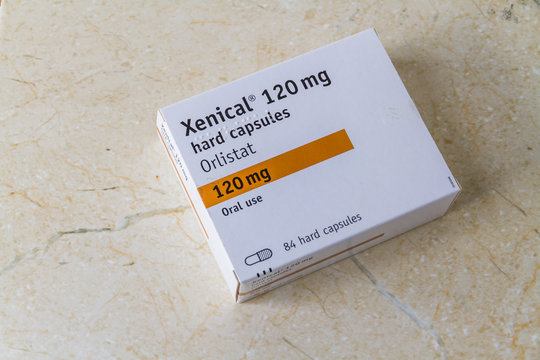 Illustrative editorial Xenical Orlistat capsules weight loss drug with copyspace