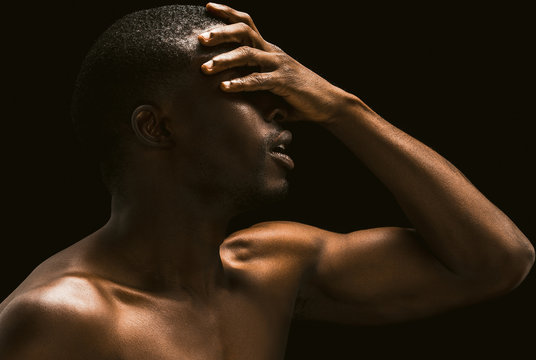 African Facepalm. Sexy African Man Covered His Face With His Hand, Profile View Of A Naked African American Young Guy Posing On Black Background Touching His Face With His Hand, . Toned Image