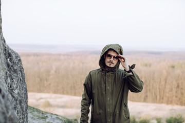 Outdoors Portrait of a stylish man with a mustache and beard in sunglasses