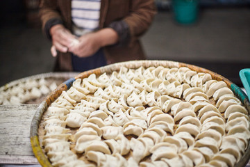 Dumplings with minced meat filling and onions steamed in the traditional nepalese way in a bamboo basket.