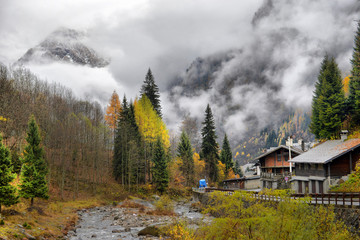 Small Alpine town street with typical houses