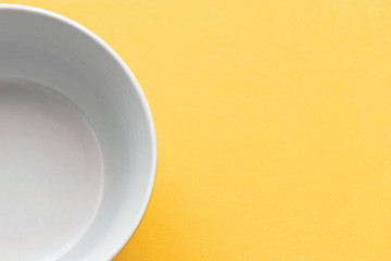 Empty white Cup on a yellow background