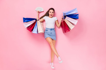 Top above high angle view full length photo shocked girl shop center client win credit bank money fan bags lay scream wear short legs mini jeans skirt isolated pastel color background