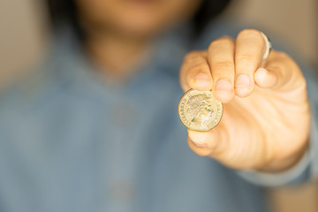 Woman Hold a coin