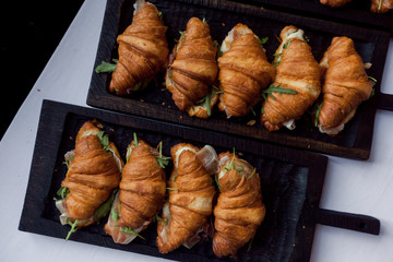 Fresh croissant on wooden table