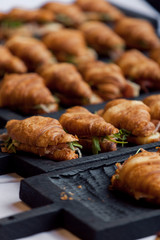 Fresh croissant on wooden table