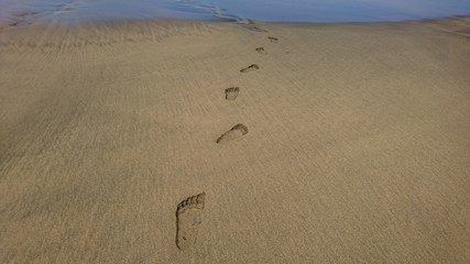 Fototapeta na wymiar footprints in sand