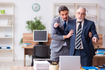 Two employees in pandemic concept at workplace