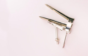 
Gynecological mirror on a white background. Copy space Gynecological examination instrument.