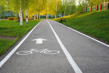 Bike path in a city Park, bike path sign on asphalt