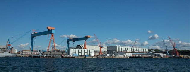 panoramic view of Kiel harbor with shipyard and cranes