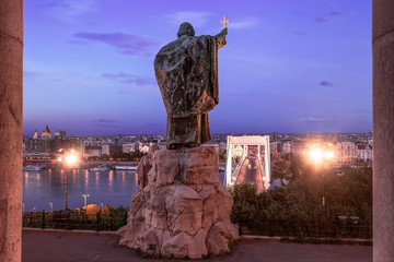 Hungary Budapest. Saint Gellert bishop monument. Erzsebet bridge on the backjground. This statue ...