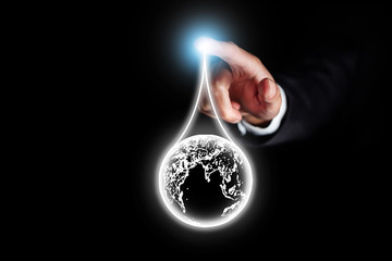 business man touch on light effect of crude oil, petroleum concept, droplet of earth in oil trading...