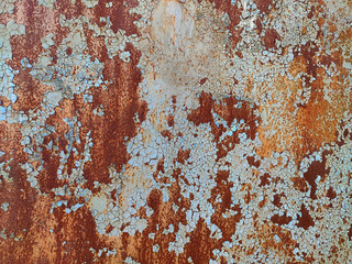 Rusty metal panel with cracked paint, corroded grunge metal background