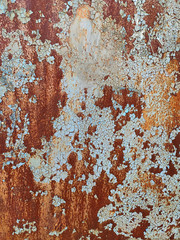 Rusty metal panel with cracked paint, corroded grunge metal background