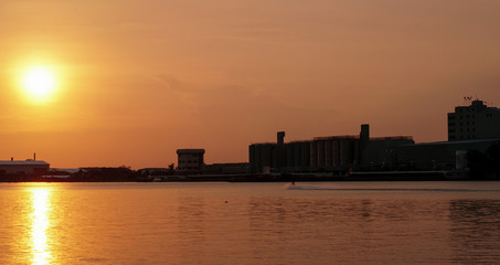 The golden sun is falling on the Chao Phraya River, Thailand.