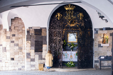 People praying in Stone doors (Kamenita vrata) in Zagreb, Croatia
