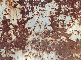 Rusty metal panel with cracked paint, corroded grunge metal background