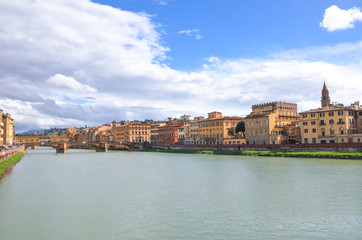 Cityscape of Florence, Tuscany, Italy. Historical center located along the Arno river. Blue sky and clouds over the Italian city. Horizontal photo.