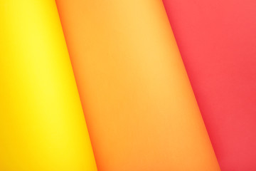 Color papers flat composition background with yellow, orange and red color