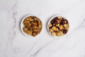 two kinds of nuts on a white background
