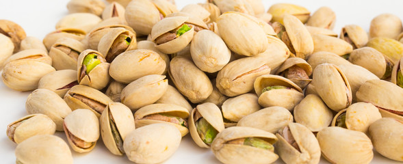 roasted pistachios on white background