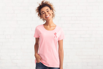 Breast Cancer Volunteer Girl Smiling Posing Over White Brick Wall